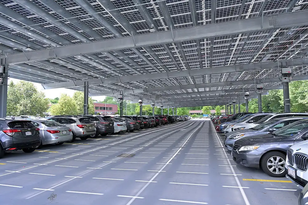 View from underneath a car park canopy made of bifacial glass-glass modules with cell grid visible from below
